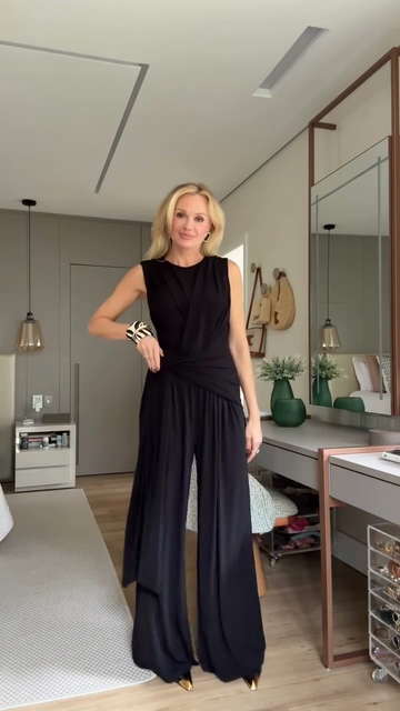 Black draped sleeveless top and wide-leg pants suit