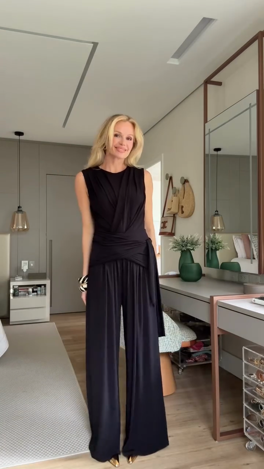 Black draped sleeveless top and wide-leg pants suit