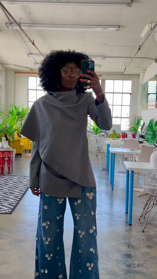 Grey asymmetrical top and embellished blue wide-leg jeans suit