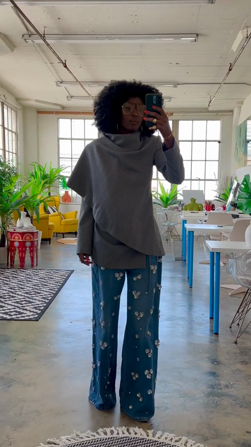 Grey asymmetrical top and embellished blue wide-leg jeans suit