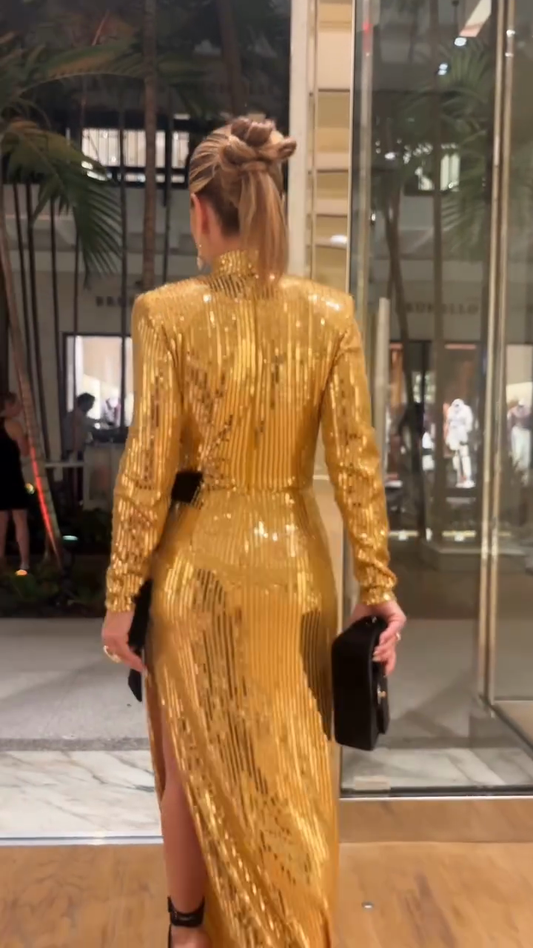 High-slit gold sequined dress