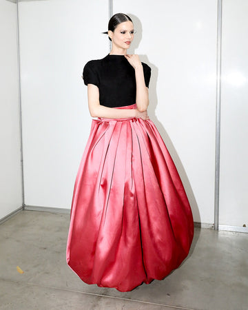 Black short-sleeved top and pink satin ballet skirt set