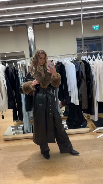 Leather trench coat with faux fur trim